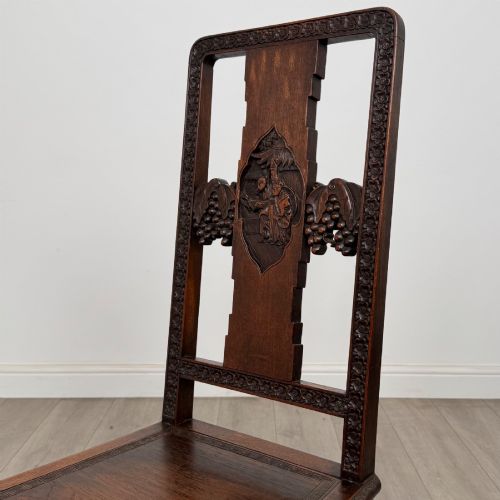 fig 5. A set of six antique dark rosewood Chinese dining chairs featuring carved back splats, scroll armrests on carvers, carved aprons, and claw feet.
