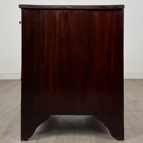 fig 2. An 18th-century Georgian dark mahogany chest of drawers with two short drawers over three long drawers and brass swan-neck handles.