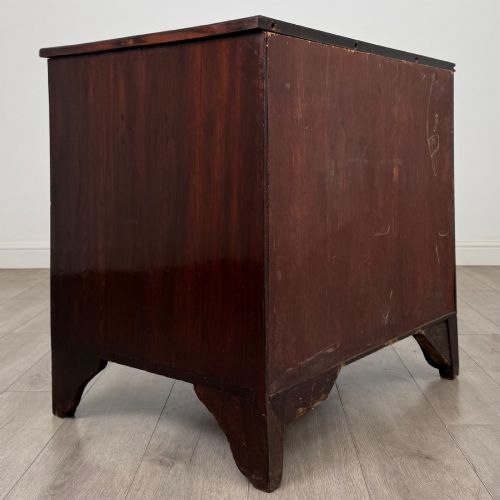 fig 3. An 18th-century Georgian dark mahogany chest of drawers with two short drawers over three long drawers and brass swan-neck handles.
