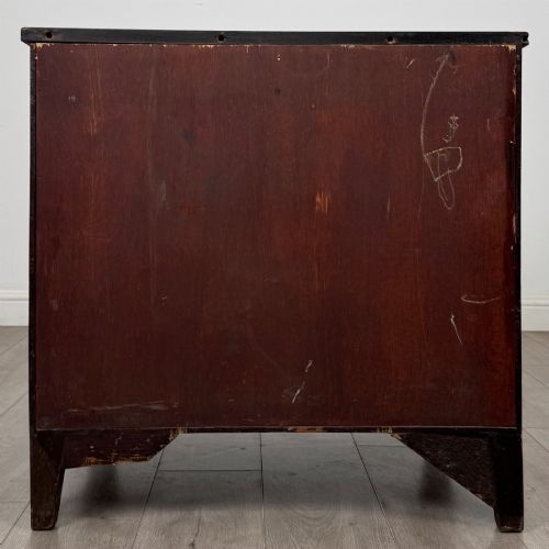 fig 4. An 18th-century Georgian dark mahogany chest of drawers with two short drawers over three long drawers and brass swan-neck handles.