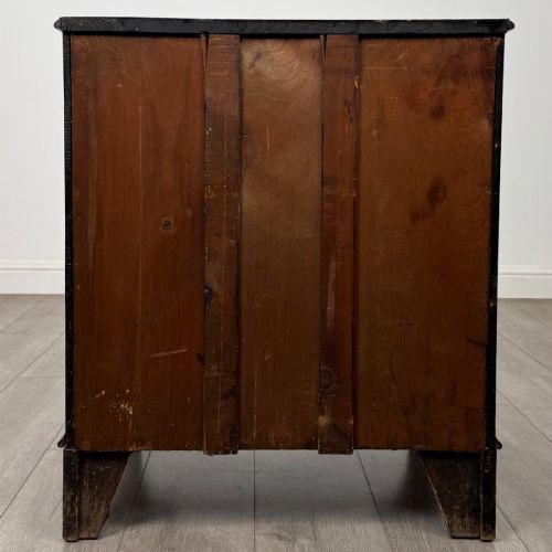 fig 5. A nineteenth-century dark mahogany small cupboard featuring two drawers with brass swan-neck handles above a double-door compartment set on bracket feet.