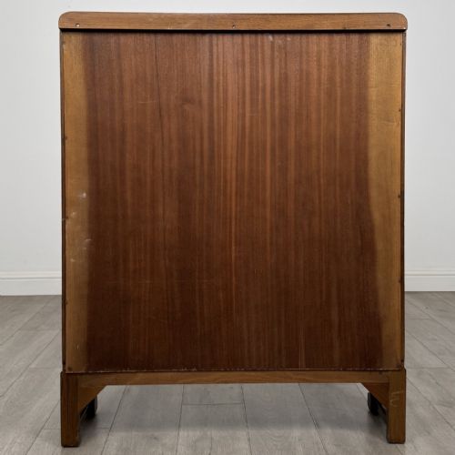 fig 5. A warm brown antique oak display cabinet featuring two glazed doors with wooden glazing bars and squat turned legs.