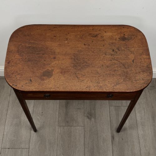 fig 8. A Georgian style mahogany side table featuring a single drawer with two circular brass handles and straight legs.
