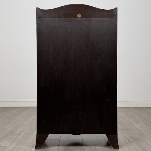 fig 6. An antique mahogany open bookcase featuring a shaped raised gallery top, two upper shelf spaces, and a lower two-door cabinet with flame mahogany veneered panels.