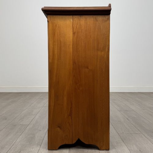 fig 2. An antique ash chest of drawers featuring a two-over-three drawer configuration with drop handles and a shaped lower apron.