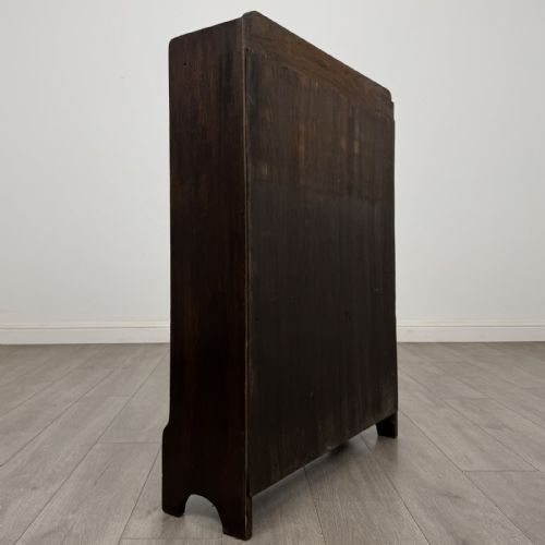 fig 4. A dark brown Edwardian oak open bookcase featuring two internal fixed shelves and simple vertical side panels.