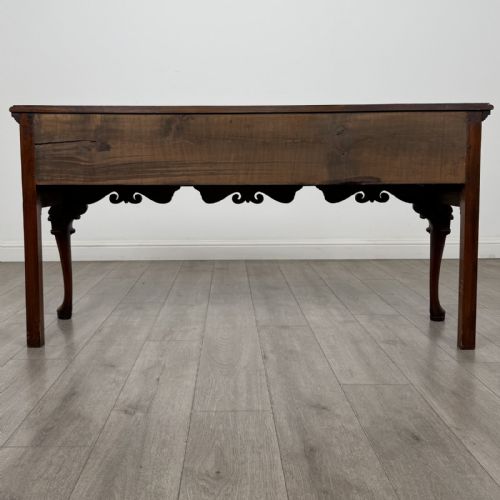 fig 4. A Queen Anne style elm dresser base featuring three drawers with brass handles, a shaped apron, and cabriole legs ending in pad feet.