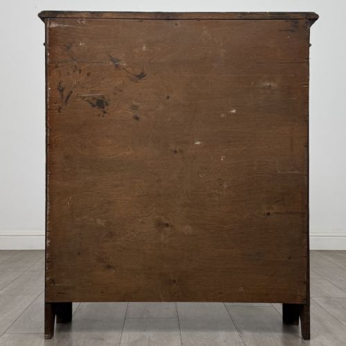 fig 5. A dark brown Victorian carved oak open bookcase with three adjustable shelves and carved decorative borders on the frieze and uprights.