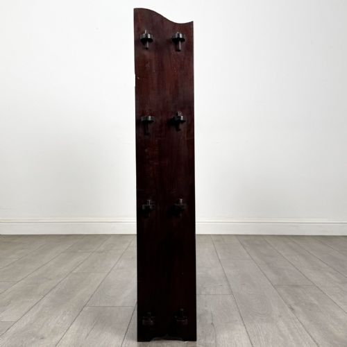 fig 7. A dark mahogany open bookcase featuring four tiered open shelves and a shaped, scalloped raised gallery back.