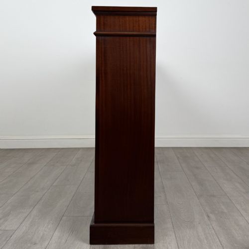 fig 3. A large 20th-century dark mahogany open bookcase featuring two wide bays with adjustable shelving and a solid plinth base.
