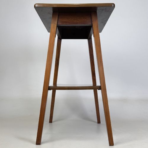fig 2. An Edwardian figured walnut lamp table featuring a square top, lower tier shelf, and tapered splayed legs.