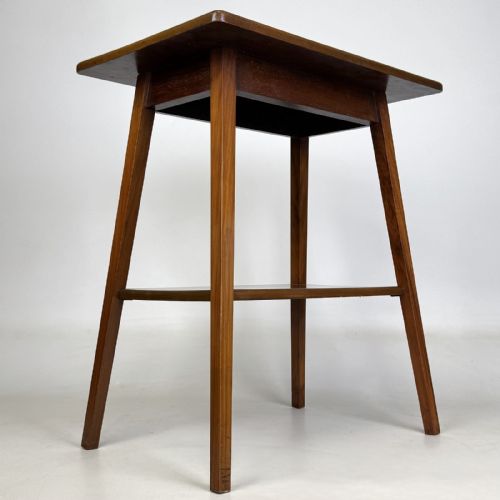 fig 3. An Edwardian figured walnut lamp table featuring a square top, lower tier shelf, and tapered splayed legs.