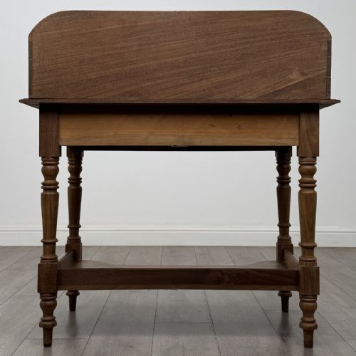 fig 4. A Victorian mahogany washstand featuring a raised rear gallery, two frieze drawers with timber knobs, turned legs, and a lower shelf.