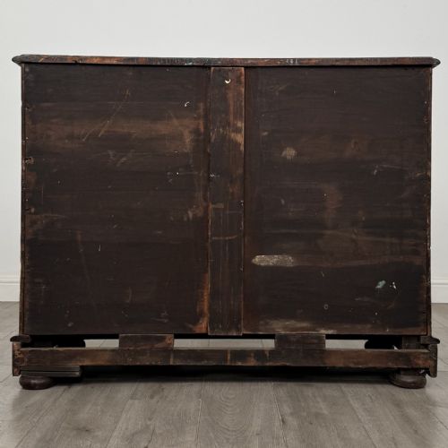 fig 4. An antique Victorian mahogany chest of drawers featuring two short drawers above three long graduated drawers with turned knobs and bun feet.