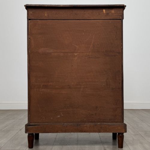 fig 5. A 19th-century Victorian walnut pier cabinet featuring floral marquetry inlays, decorative gilt metal mounts, a single glazed glass door, and velvet-lined interior shelves.