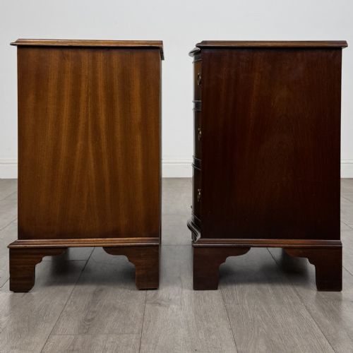 fig 3. A matching pair of Georgian style mahogany bedside chests with serpentine fronts, three drawers each, brass ring handles, and bracket feet.