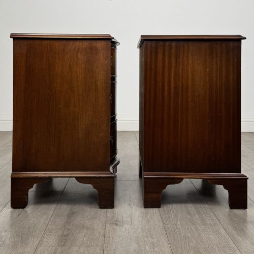 fig 7. A matching pair of Georgian style mahogany bedside chests with serpentine fronts, three drawers each, brass ring handles, and bracket feet.