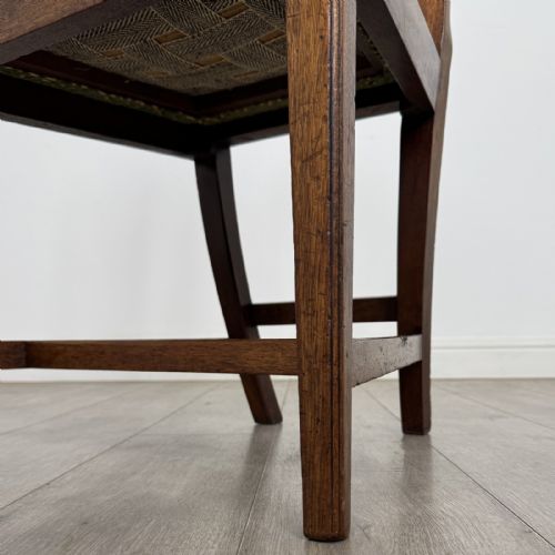 fig 5. A set of four 18th-century Georgian mahogany dining chairs featuring carved pierced back splats and green patterned upholstered seats.