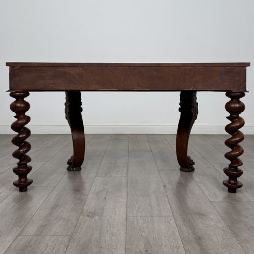 fig 4. A Victorian mahogany console table with carved cabriole front legs, spiral rear legs, and a single drawer with round wooden handles.