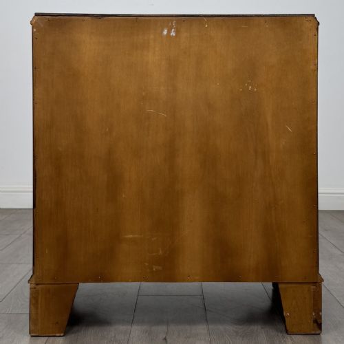 fig 4. A Georgian style mahogany serpentine chest featuring four graduated drawers with brass drop handles and bracket feet.