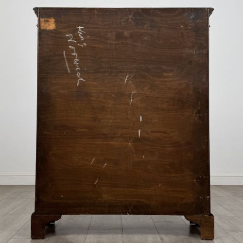 fig 5. A dark oak Georgian style display cabinet featuring twin glazed doors with rectangular timber mullions and bracket feet.