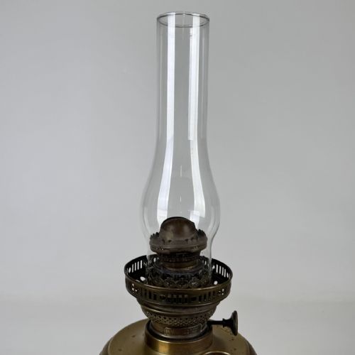 fig 5. An antique brass column oil lamp featuring an etched glass globe shade, clear chimney, brass reservoir, fluted stem, and dark veined marble base.