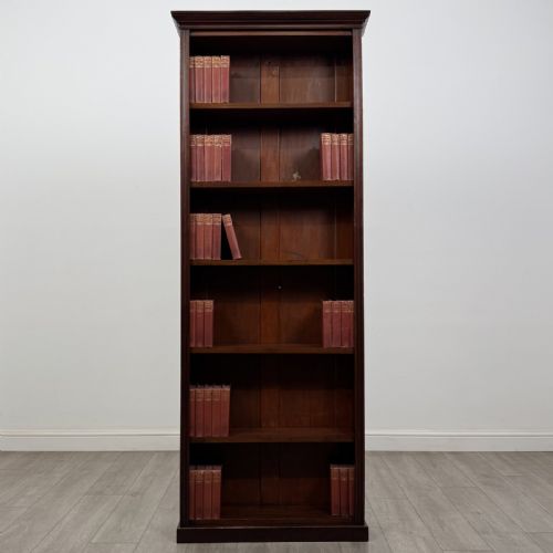 fig 1. A tall, narrow mahogany open bookcase featuring six shelving compartments, a moulded top cornice, and a solid plinth base.