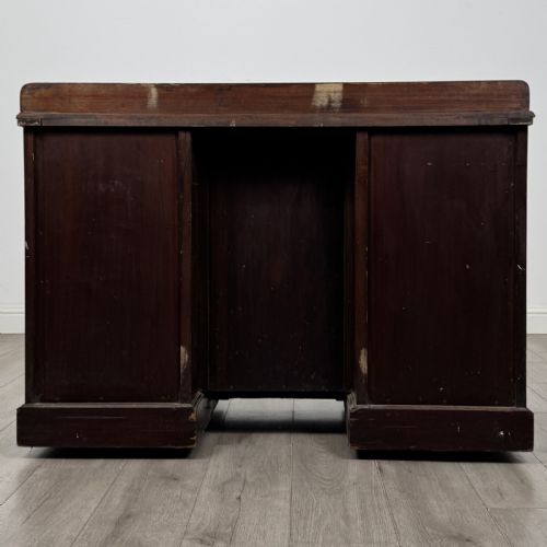 fig 4. A dark rosewood Victorian breakfront sideboard with three cupboard doors featuring intricate satinwood urn and scroll marquetry inlays.
