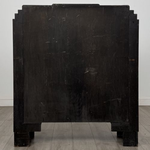 fig 4. A dark oak Art Deco display cabinet with two glazed doors, geometric glazing bars, stepped side shoulders, and reeded square feet.
