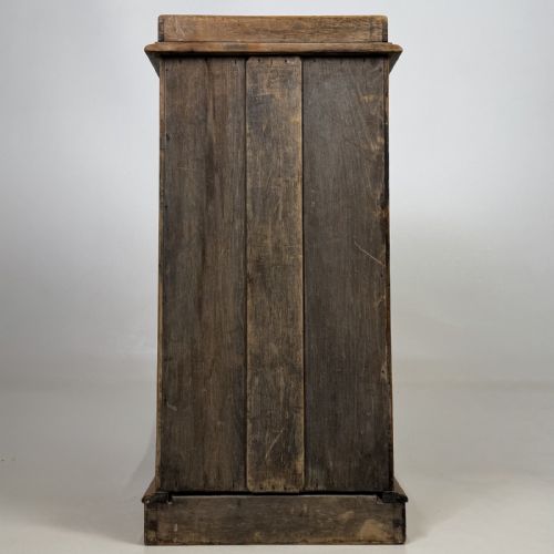 fig 4. An antique natural pine pot cupboard featuring a single arched panel door, turned wooden knob handle, side top galleries, and a solid plinth base.
