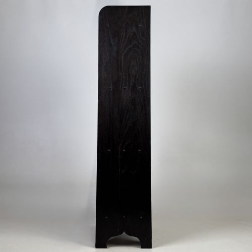 fig 2. A tall narrow dark oak open bookcase featuring a gallery top and three shelves above a shaped base.