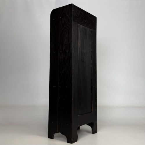 fig 3. A tall narrow dark oak open bookcase featuring a gallery top and three shelves above a shaped base.