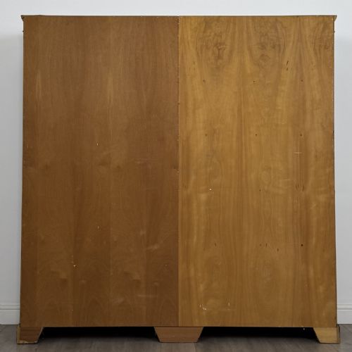 fig 4. A large 20th-century double-width open oak bookcase with a moulded cornice, central vertical divider, and ten spacious open shelves.