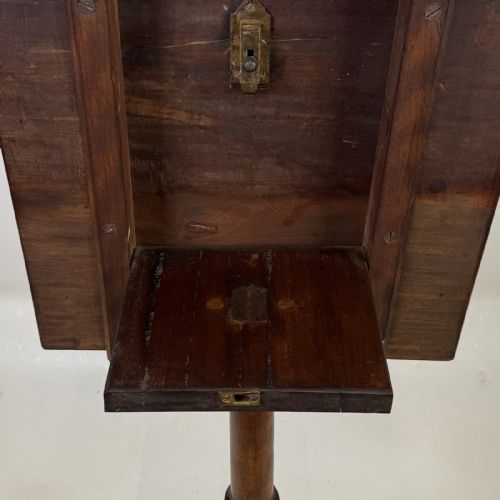 fig 5. An antique Georgian mahogany tilt-top tripod table featuring a square top supported by a turned central column and three cabriole legs with pad feet.