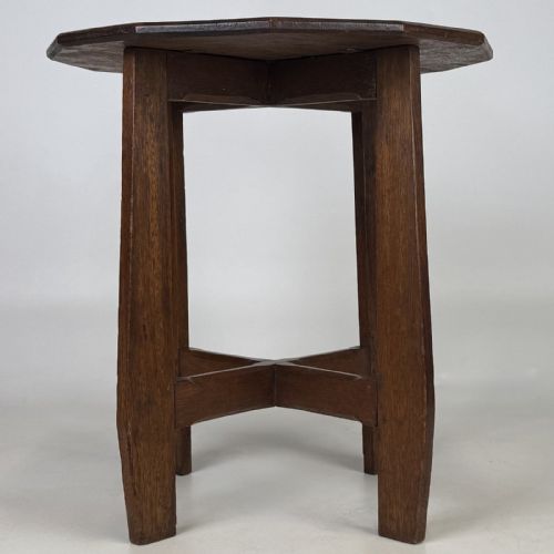 fig 1. An antique Arts and Crafts solid oak lamp table featuring a twelve-sided polygonal top supported by four tapered square legs and cross-stretchers.