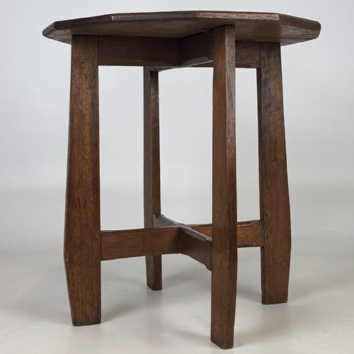 fig 2. An antique Arts and Crafts solid oak lamp table featuring a twelve-sided polygonal top supported by four tapered square legs and cross-stretchers.
