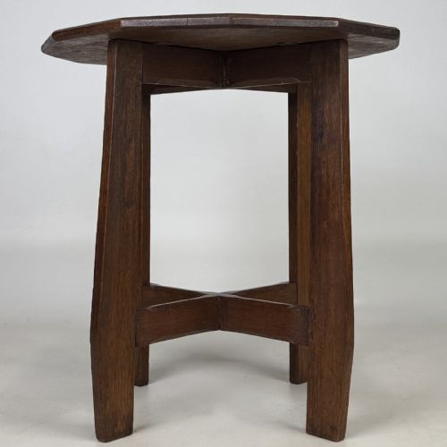 fig 3. An antique Arts and Crafts solid oak lamp table featuring a twelve-sided polygonal top supported by four tapered square legs and cross-stretchers.