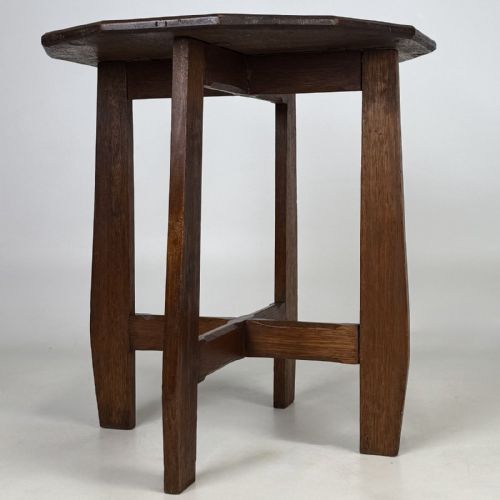 fig 4. An antique Arts and Crafts solid oak lamp table featuring a twelve-sided polygonal top supported by four tapered square legs and cross-stretchers.