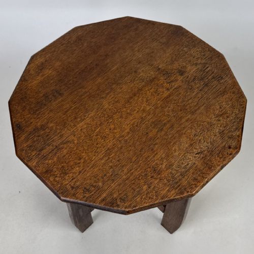 fig 5. An antique Arts and Crafts solid oak lamp table featuring a twelve-sided polygonal top supported by four tapered square legs and cross-stretchers.