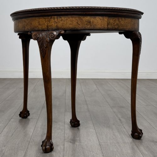 fig 2. A Georgian style burr walnut card table featuring carved cabriole legs terminating in ball and claw feet.