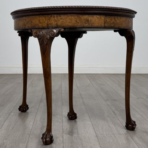 fig 3. A Georgian style burr walnut card table featuring carved cabriole legs terminating in ball and claw feet.