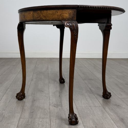 fig 5. A Georgian style burr walnut card table featuring carved cabriole legs terminating in ball and claw feet.