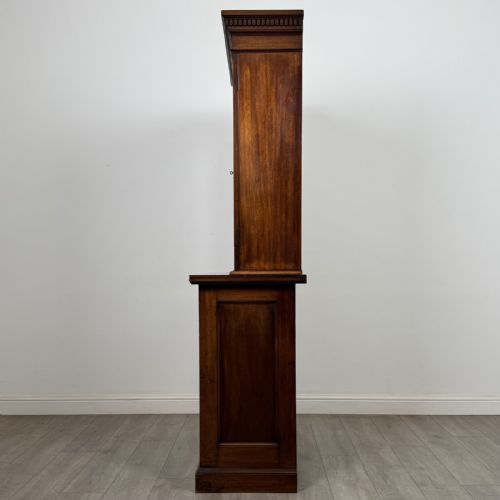 fig 2. A Victorian walnut glazed bookcase featuring a two-door glass display upper section above two drawers and a double cupboard base.