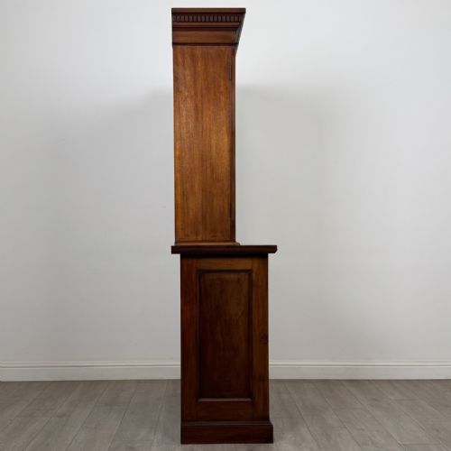 fig 6. A Victorian walnut glazed bookcase featuring a two-door glass display upper section above two drawers and a double cupboard base.
