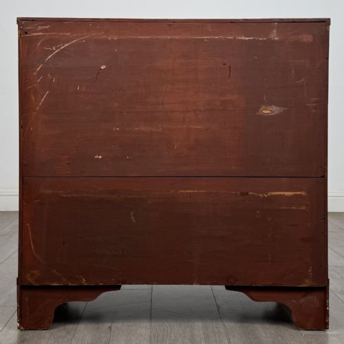 fig 4. A straight-front Georgian style mahogany chest features four full-width drawers with decorative oval brass drop handles, keyhole escutcheons, and bracket feet.