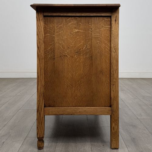 fig 2. An Edwardian quarter-sawn oak chest of drawers with two short drawers over two long drawers and turned wooden handles.
