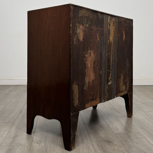 fig 3. A 19th-century dark mahogany bow front chest of drawers featuring two short drawers above two long drawers with turned wooden handles and bracket feet.