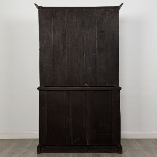 fig 5. An antique Victorian mahogany glazed bookcase featuring two upper glass doors, twin frieze drawers, and lower panelled doors.