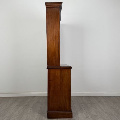 fig 7. An antique Victorian mahogany glazed bookcase featuring two upper glass doors, twin frieze drawers, and lower panelled doors.