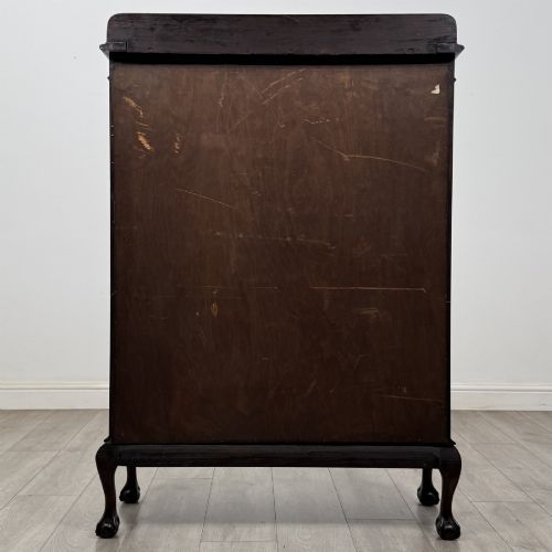 fig 4. A dark mahogany display cabinet featuring two glazed doors with geometric arch bars and carved ball-and-claw feet.